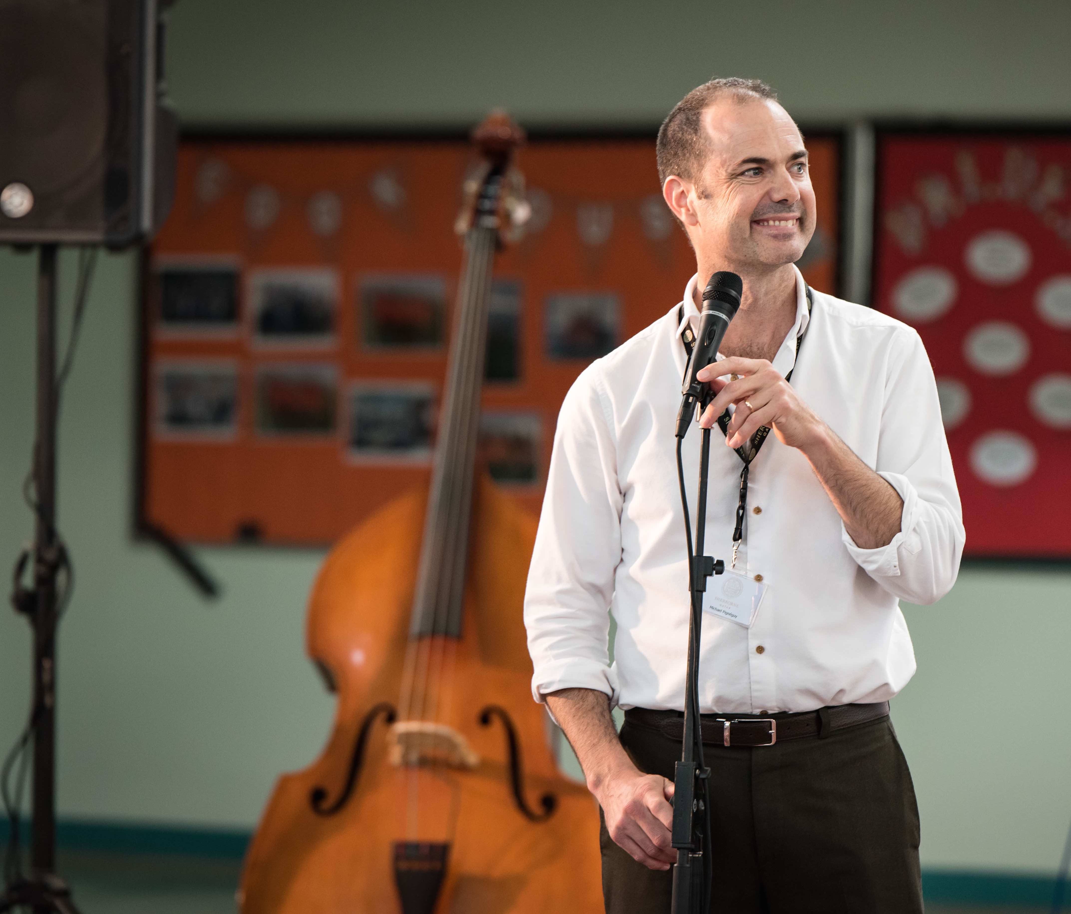 Michael Pignéguy speaking at a music workshop